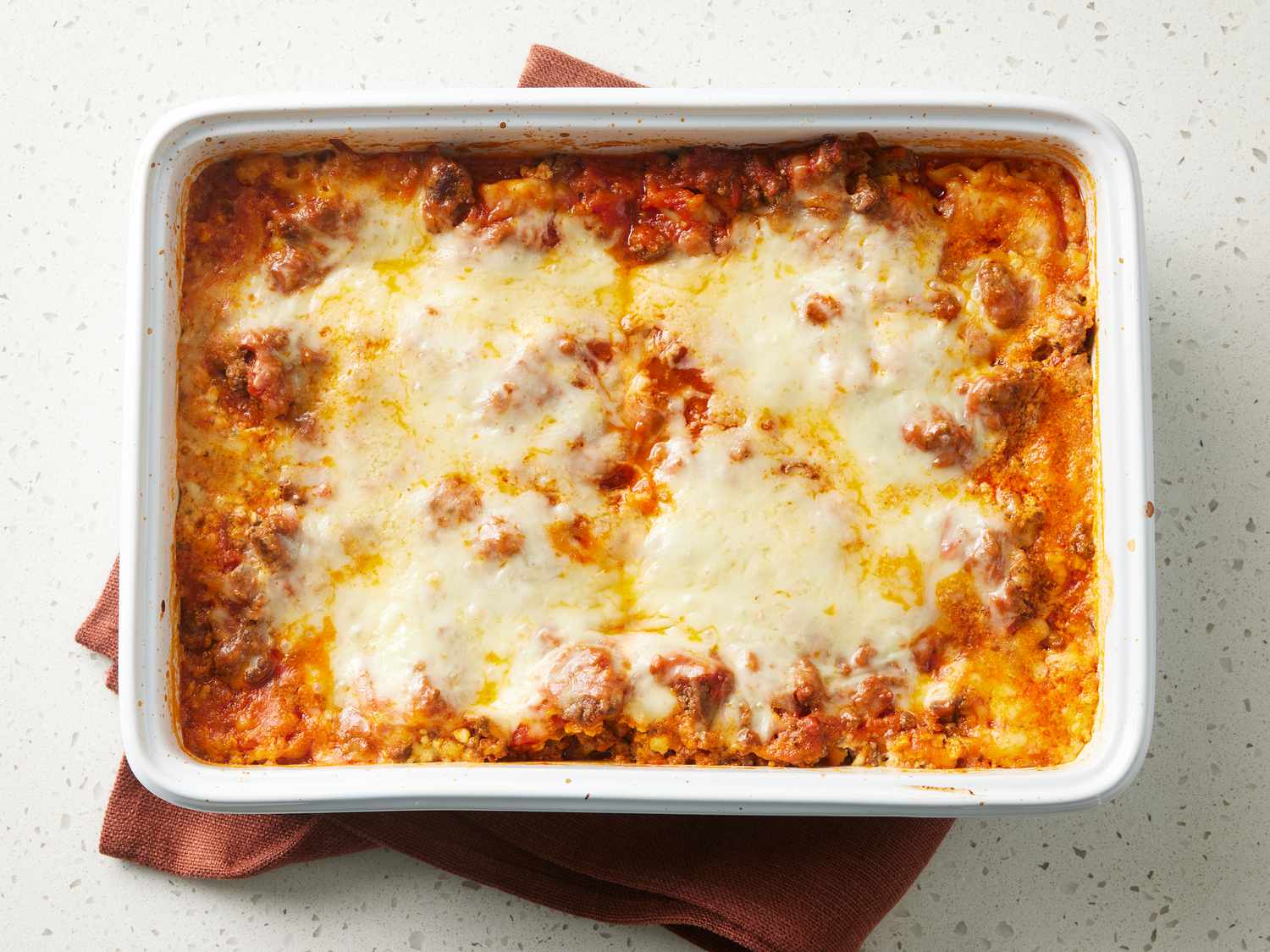 Layered baked lasagna with pasta, meat sauce, and cheese